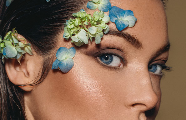 A woman with flowers on her face
